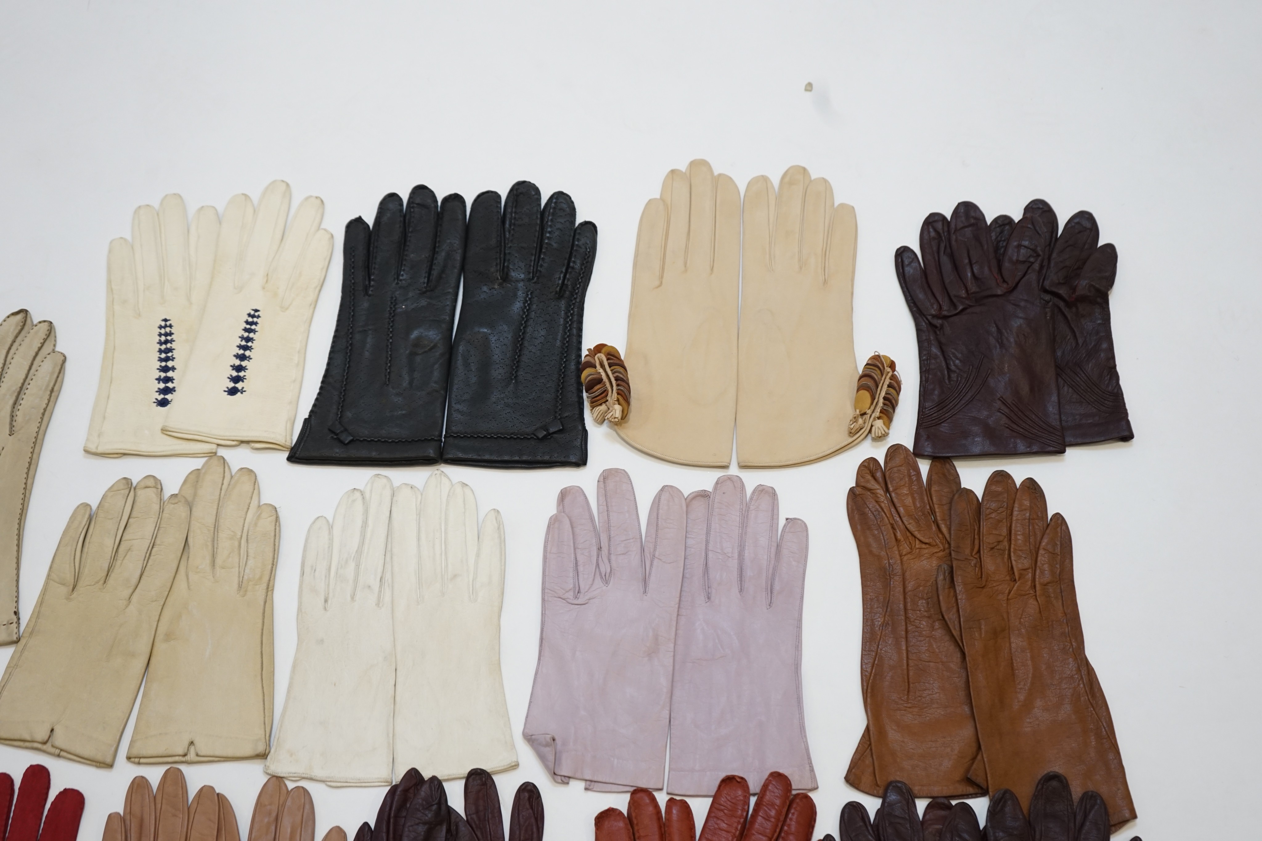 A large collection of assorted ladies gloves, including Christian Dior, many unworn, size 7-7.5